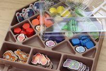 Load image into Gallery viewer, Close up of the GameTrayz insert that contains the yarn token and crafted chits in the game
