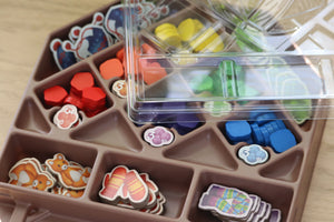 Close up of the GameTrayz insert that contains the yarn token and crafted chits in the game